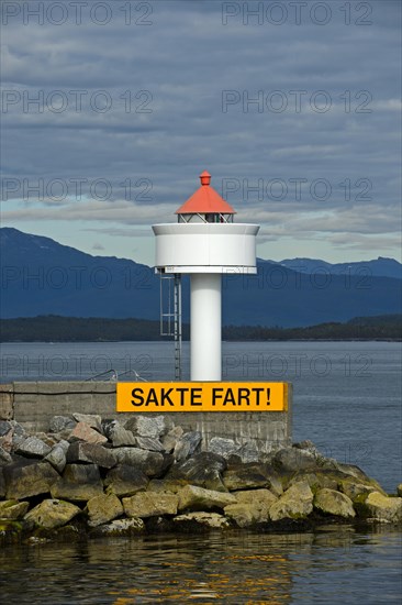 Molde lighthouse with sail slowly warning sign