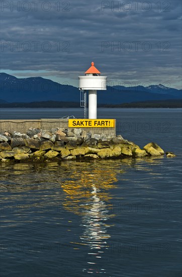 Molde lighthouse with sail slowly warning sign