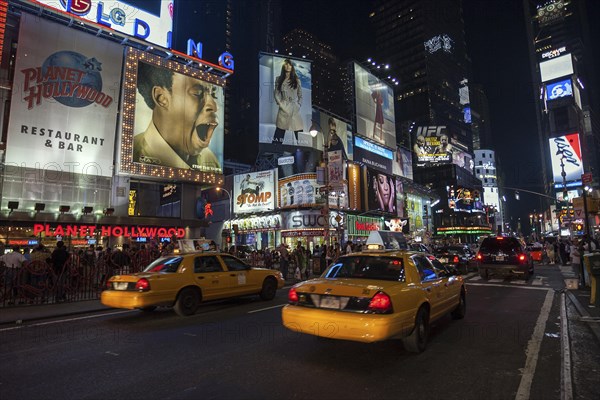 Taxis and illuminated advertising at night
