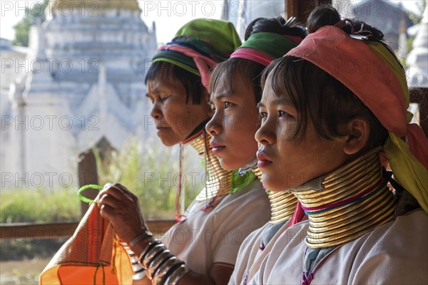 Women from the Padaung tribe in typical dress and headgear