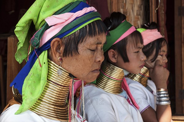 Women from the Padaung tribe in typical dress and headgear