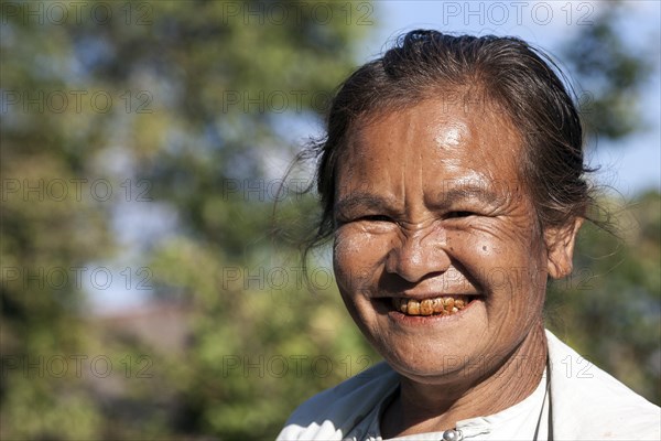 Old local woman laughing