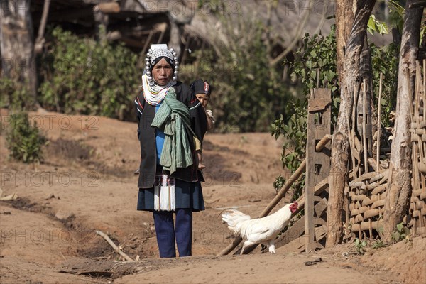 Local woman from the Akha tribe in typical clothes and typical headgear