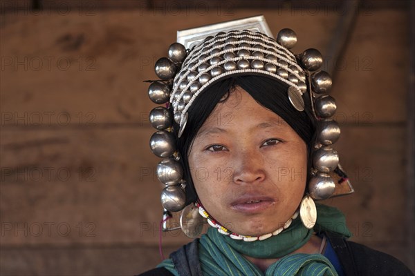 Local woman from the Akha tribe with typical headgear