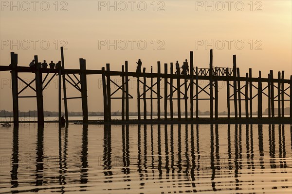 People walking on the U Bein Bridge