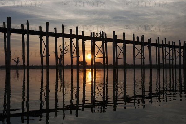 People walking on the U Bein Bridge