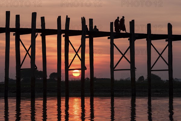 Two monks walking on the U Bein Bridge