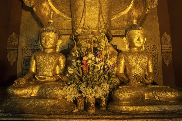 Two seated gilded Buddha statues