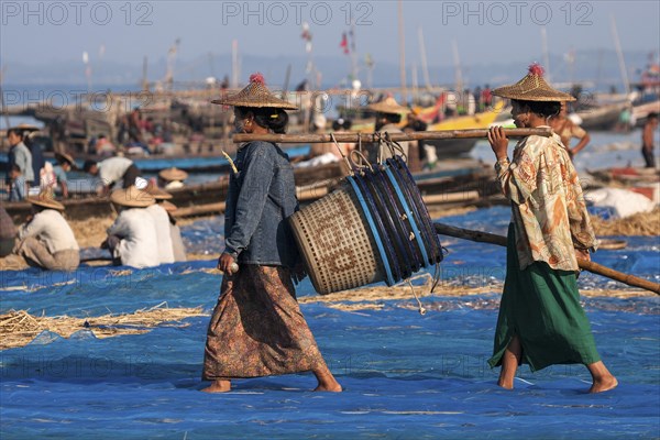 Local women wearing a straw hat