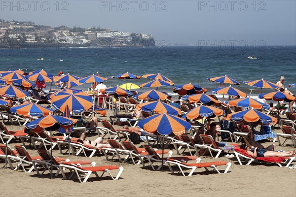 Beach with umbrellas and sunbeds