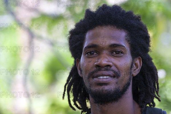 Indigenous man with dreadlocks