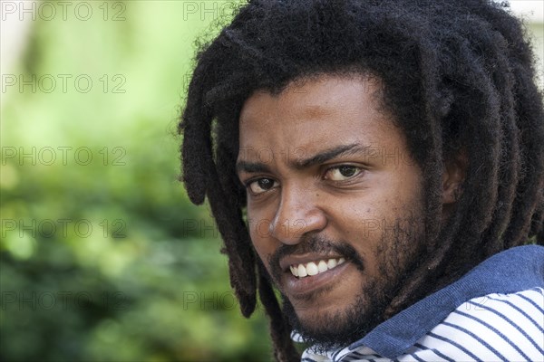 Indigenous man with dreadlocks