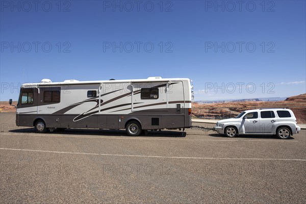 Large caravan with car attached