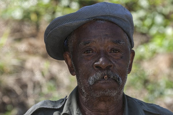 Local man with a cigarette and cap