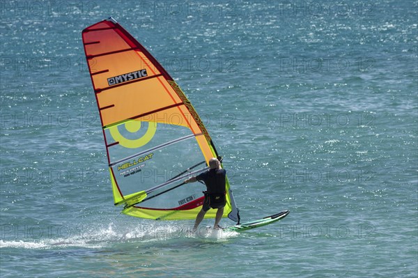 Windsurfer surfing in the sea