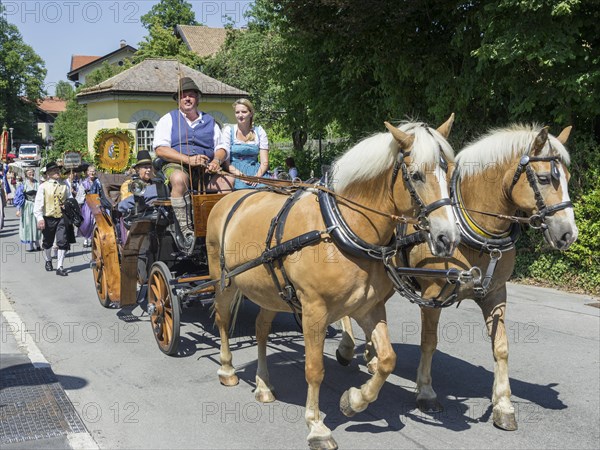Horse-drawn carriage at Traditional parade on the Schliersee church day