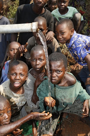 Boys at a waterhole