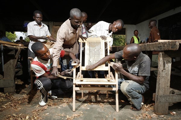 Apprentices working on chair