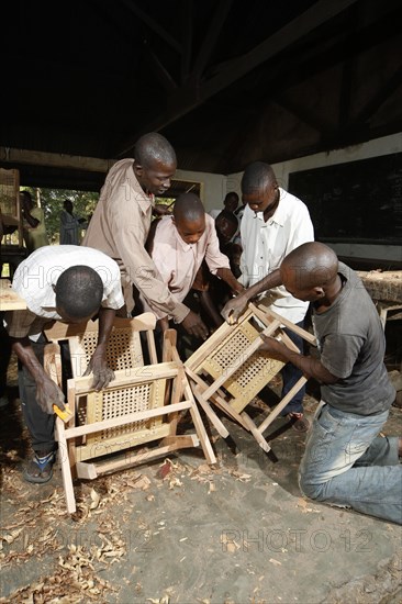 Apprentices working on chair