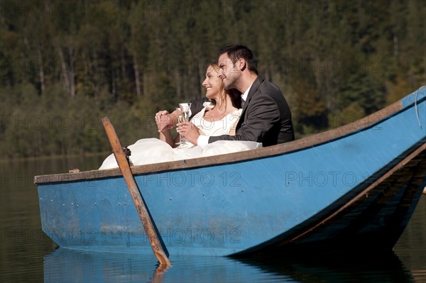 Wedding couple in a rowboat