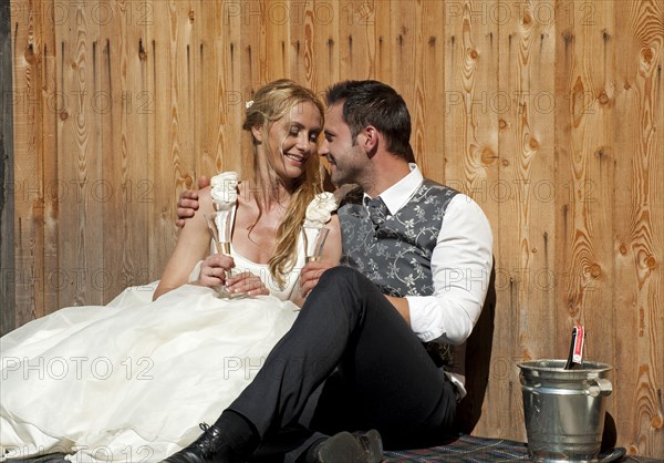 Wedding couple celebrating with champagne