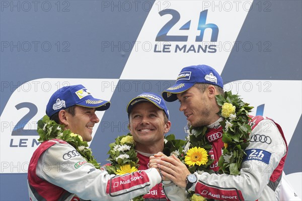 The drivers of the third-placed Audi R18 e-Tron Quattro from Audi Sport Team Joest