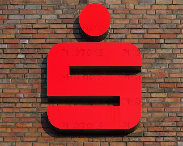 Sparkasse logo on a brick house wall