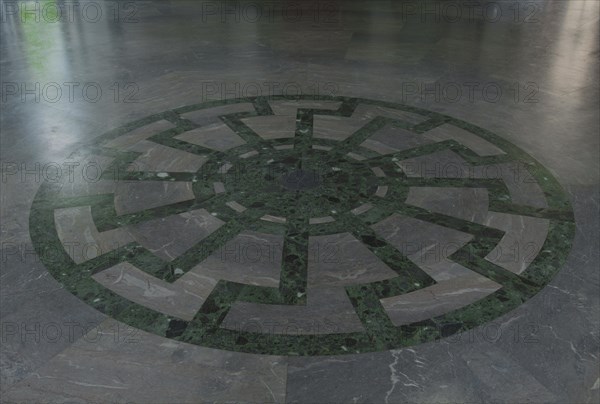 Ornament of the Black Sun wheel mosaic with superimposed swastikas in the floor of Obergruppenfuhrersaal