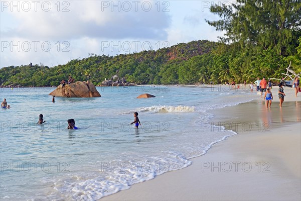 People enjoying the beach in the evening