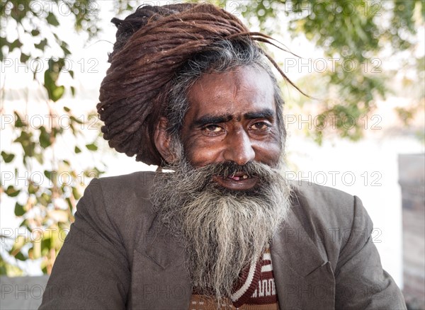 Smiling Rajasthani with matted hair and beard