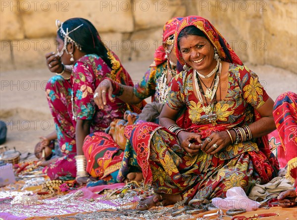 Saleswomen in colourful saris selling souvenirs