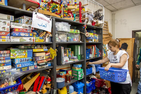 Warehouse for refugees with toys