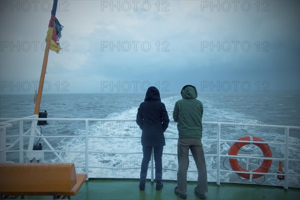 Passengers on the ferry from Bensersiel to Langeoog in bad weather