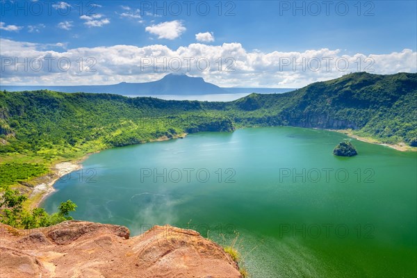 Steam rising from vents on the ridge of Taal Volcano overlooking the Lake Taal crater lake on Volcano Island