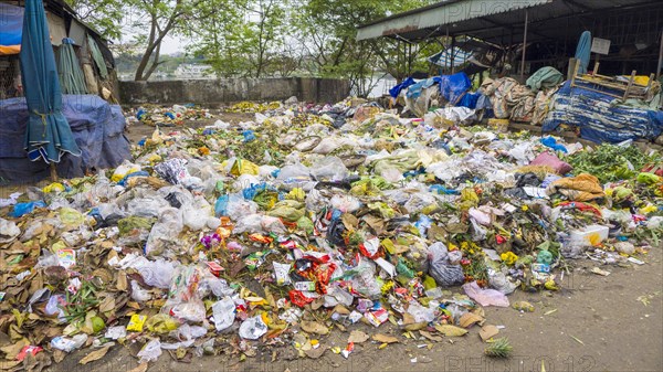 Pile of trash and rotten food at street market