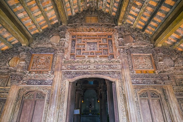 Wood carvings on the facade of Sacred Heart Chapel at Phat Diem Cathedral