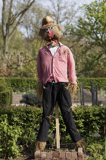 Scarecrow in the herb garden of Grugapark