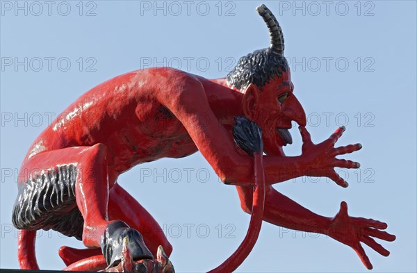 Devil thumbing his nose