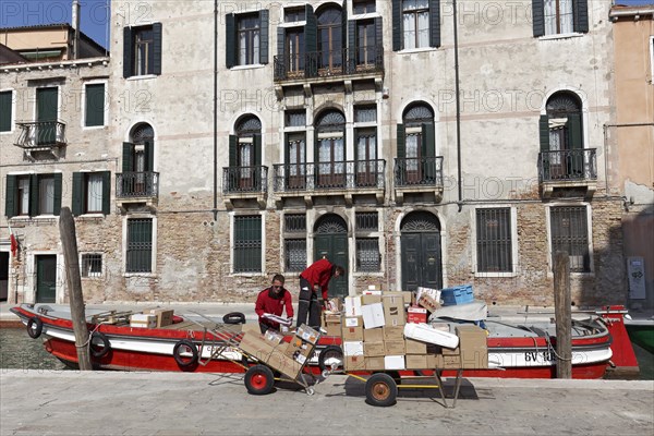 Boat with packages on a channel