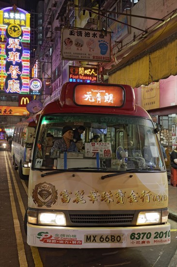 Public Light Bus Red in a nighttime street