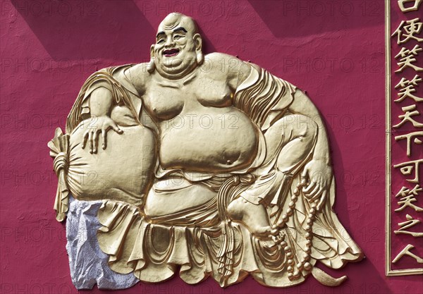 Laughing Buddha with stuffed alms-bag