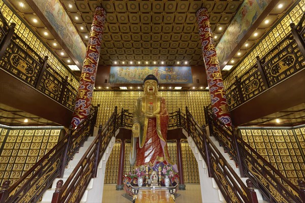 Buddhist funeral hall with urns with larger than life Amitabha Buddha statue