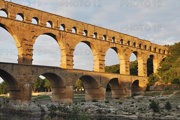 Roman aqueduct Pont du Gard over the Gardon in the evening