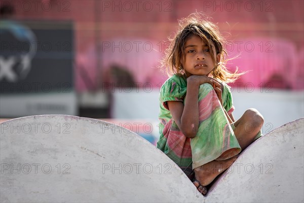 Girl sitting on a wall