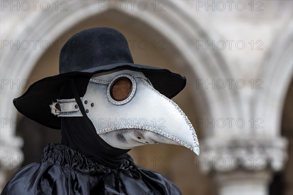 A man dressed in plague doctor costume