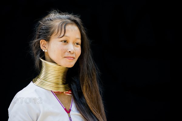 Young Kayan hill tribe woman doing her hair