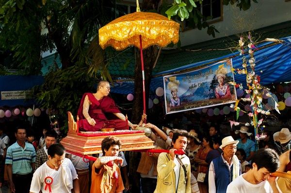 Family taking part in the annual Poi Sang Long Festival when young boys enter the temple as novice monks