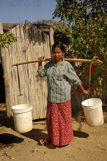 Burmese woman wearing a Longyi skirt