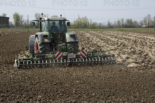 Tractor plowing a field in spring