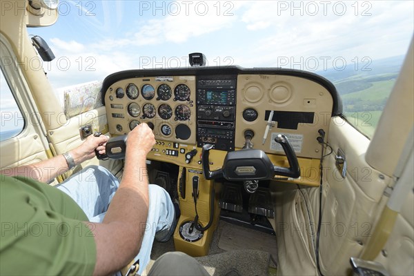 Inside view of single-engined sports plane cockpit